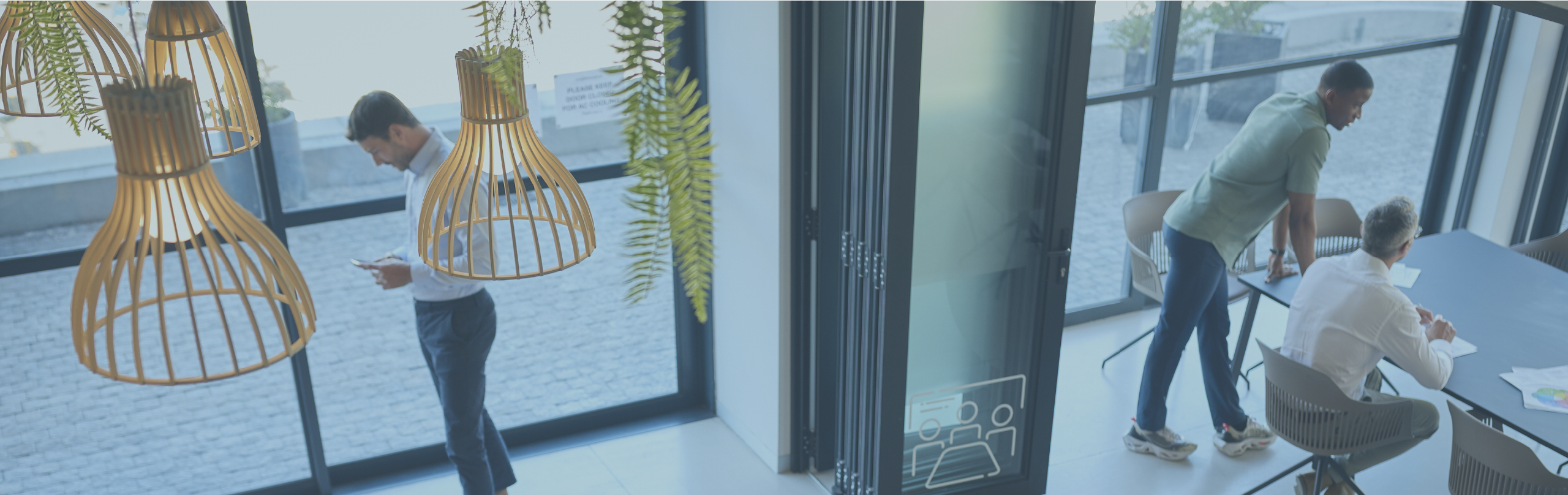 High angle view of a diverse group of businesspeople talking together around a conference table during a boardroom meeting in an office